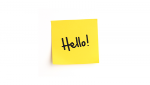 'Hello!' written in pen on a yellow Post-It note