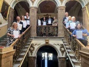 Sandwell Business Ambassadors' charter: SBAs lined up around the stone staircase at Smethwick Council HOuse